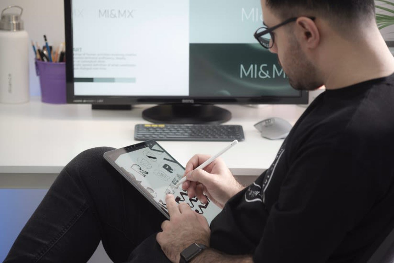Man doing logo design on tablet